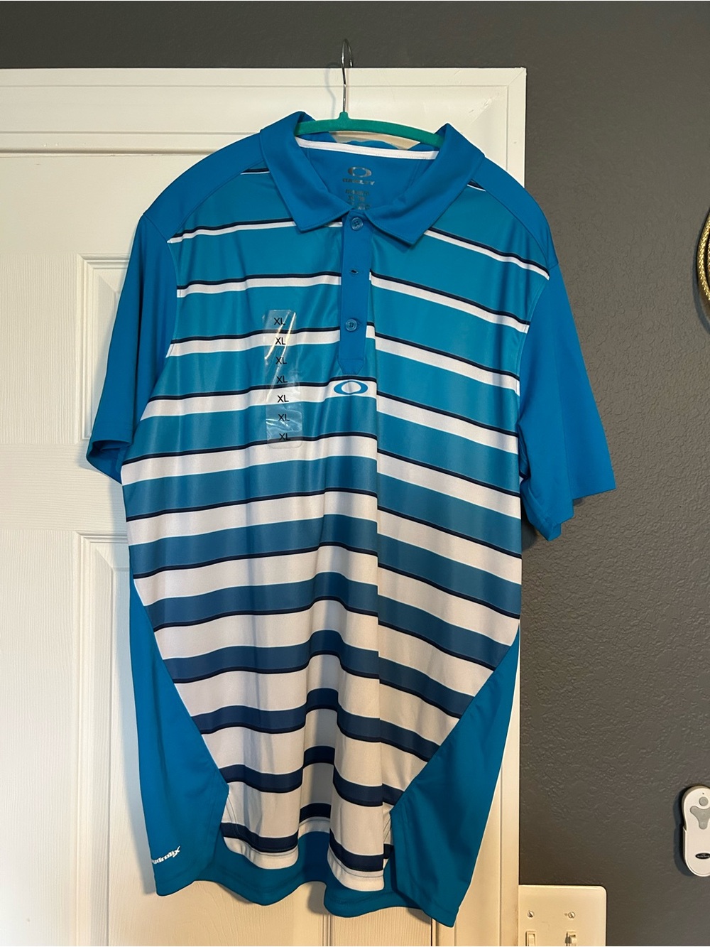 NWOT Oakley Teal and Navy Striped Performance Polo